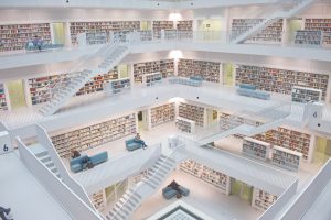 Decorative header image of the interior of a library with four stories.